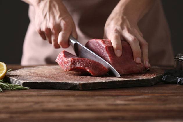 Cutting large pieces of meat cutting large pieces of meat